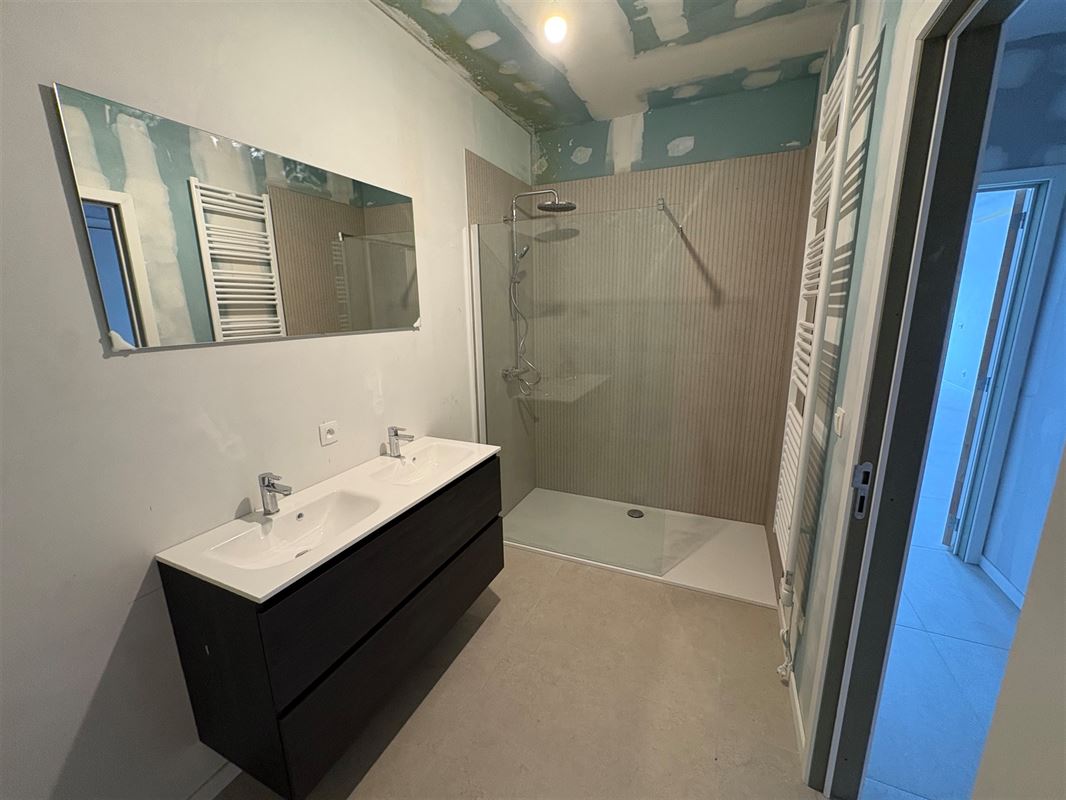 Nieuwbouwappartement met 2 slaapkamers en grote tuin.