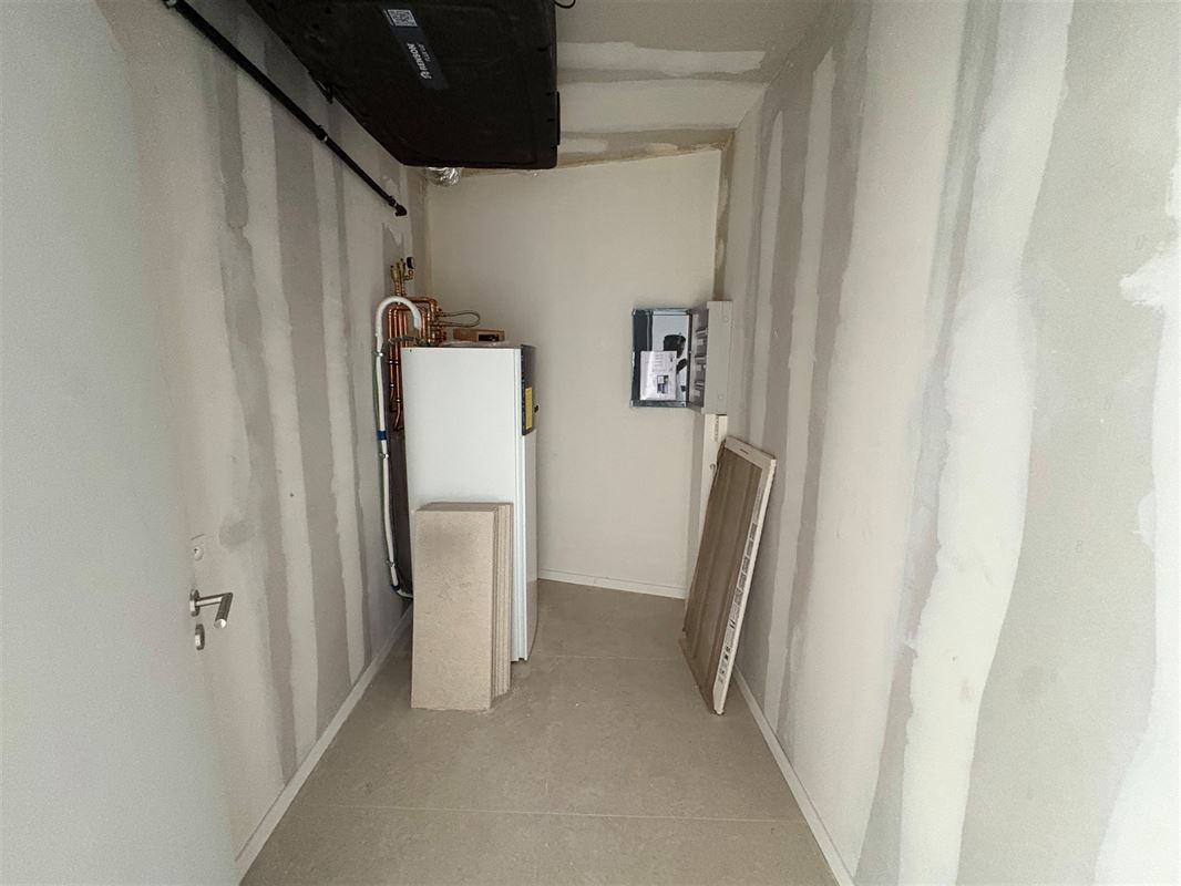 Nieuwbouwappartement met 1 slaapkamer en grote tuin.