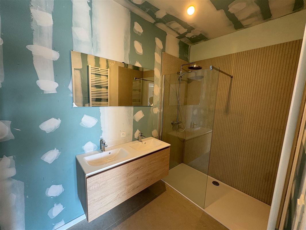 Nieuwbouwappartement met 1 slaapkamer en extra grote tuin.