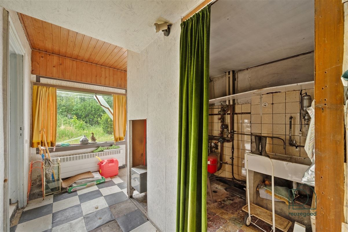 Te renoveren huis (tweewoonst)  met mogelijkheid tot 2 bouwgronden