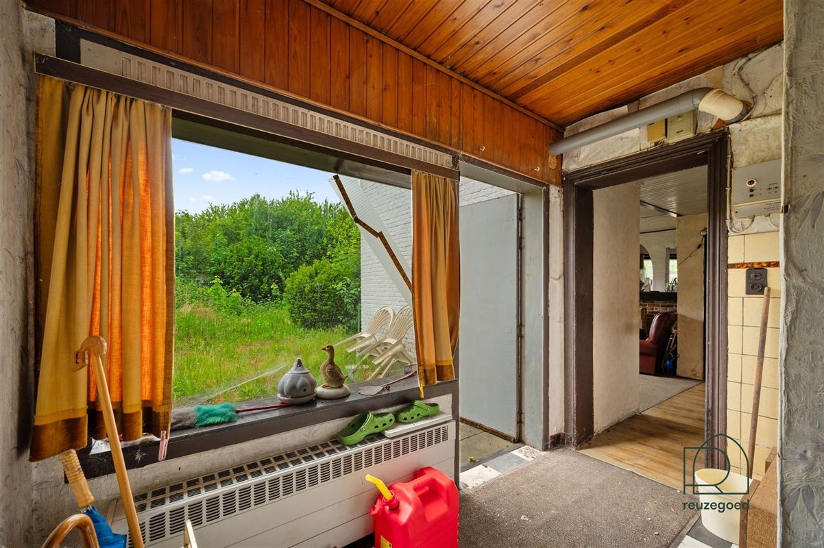 Te renoveren huis (tweewoonst)  met mogelijkheid tot 2 bouwgronden