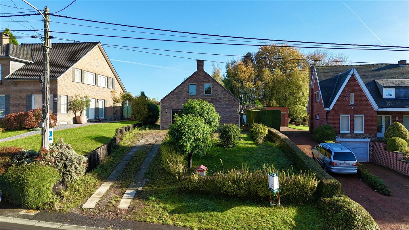 MAISON UNIFAMILIALE BIEN SITUÉE AVEC JARDIN et GARAGE!