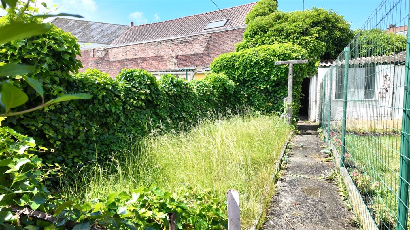 Degelijke rijwoning met garage en tuin!