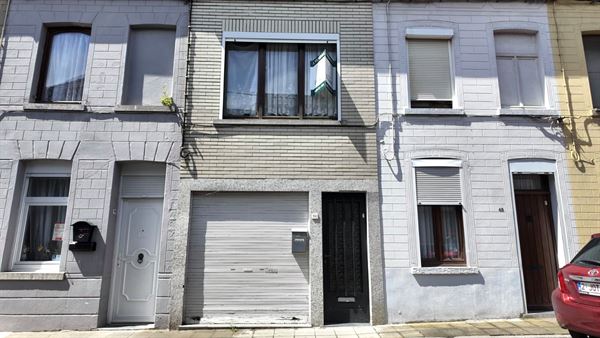 Degelijke rijwoning met garage en tuin!