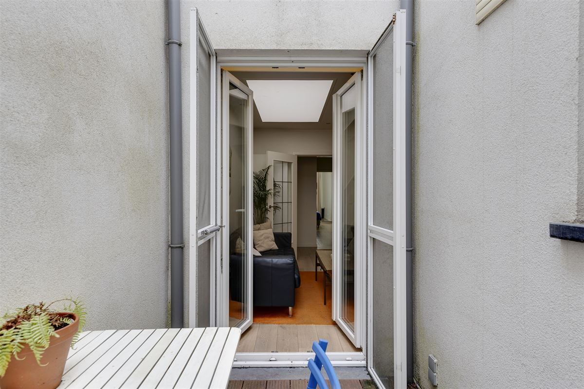 Cozy gelijkvloers appartement met stadskoer