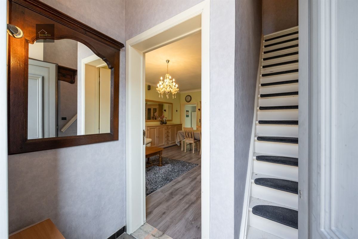 Te renoveren rijwoning met tuintje