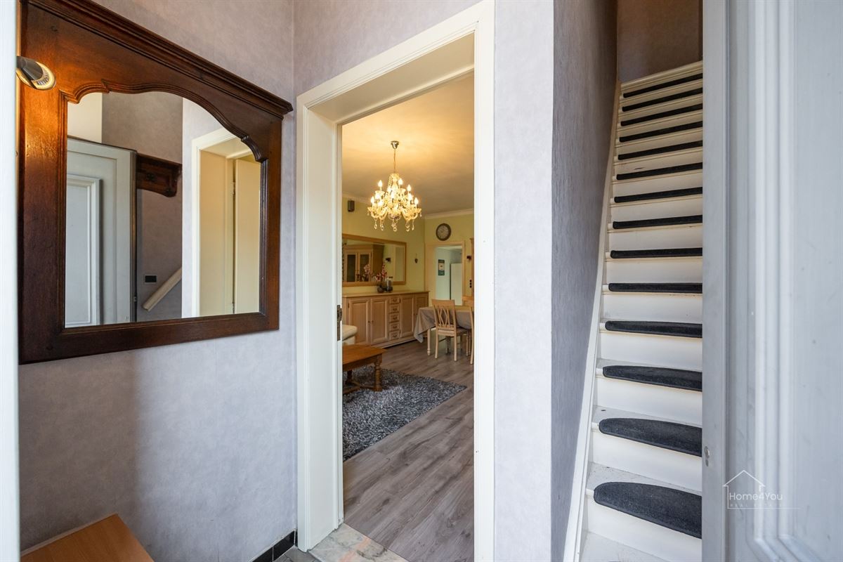 Te renoveren rijwoning met tuintje