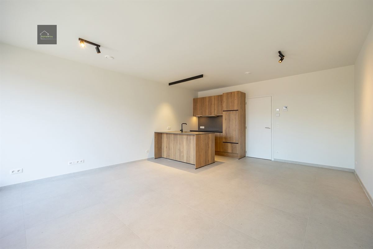 Appartement met terras en autostaanplaats