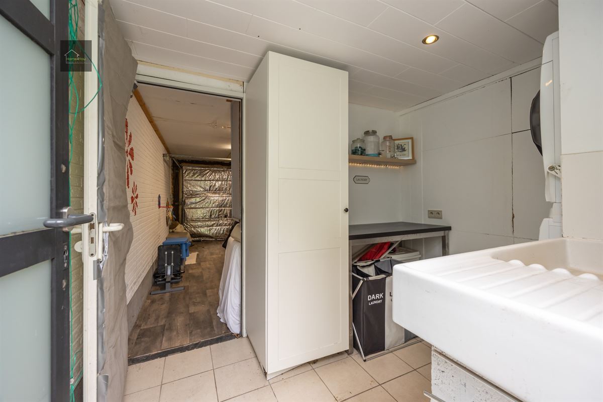 Gelijkvloers appartement met grote tuin en garage