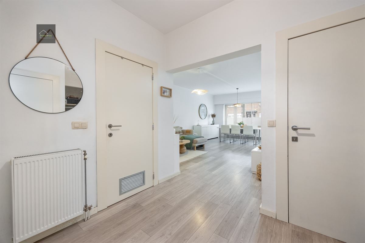 Gelijkvloers appartement met grote tuin en garage