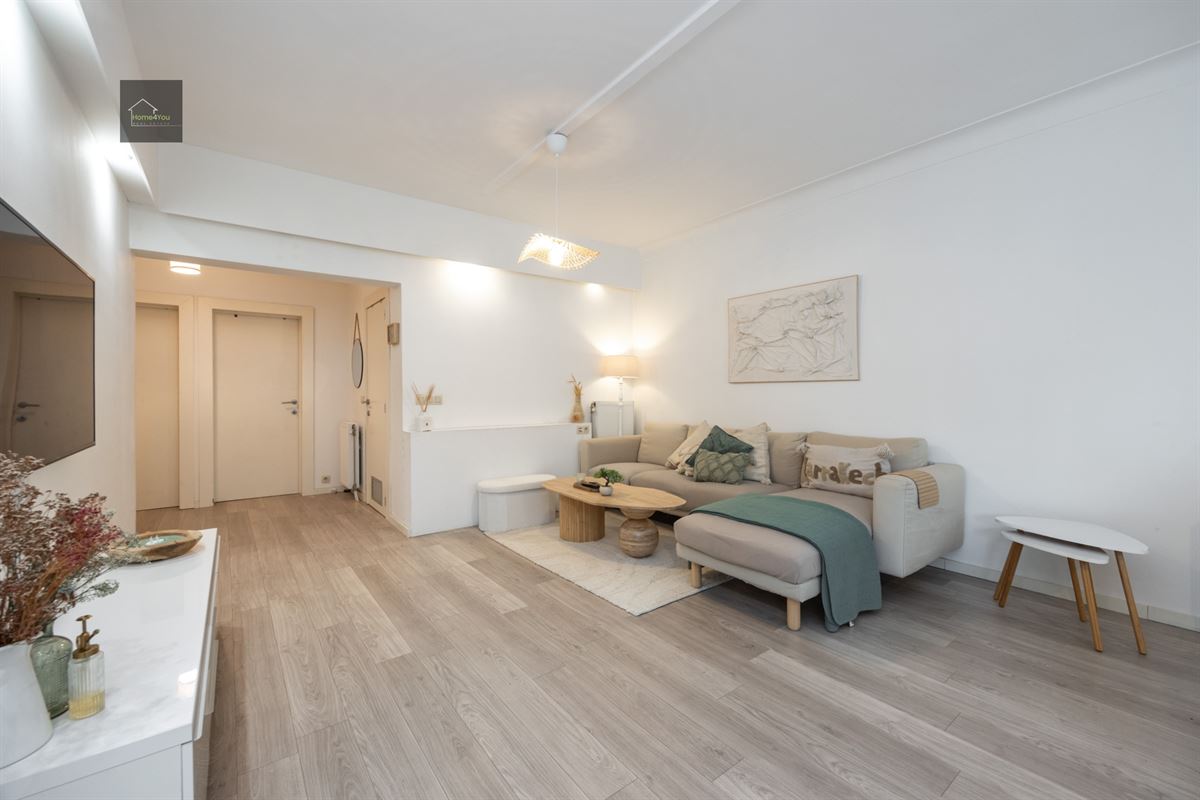 Gelijkvloers appartement met grote tuin en garage
