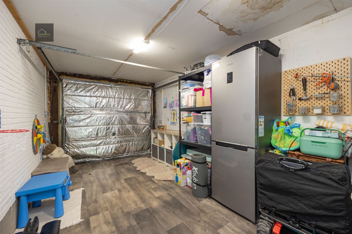 Gelijkvloers appartement met grote tuin en garage