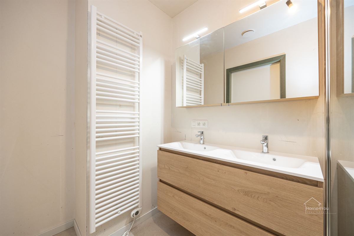 Nieuwbouw gelijkvloers appartement met aangename tuin