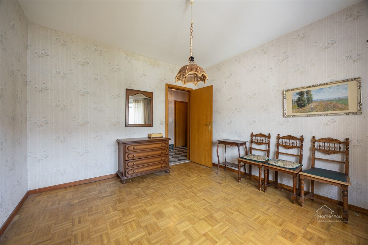 Op te frissen appartement met 1slpk, tuin en een garagebox te Schoten!