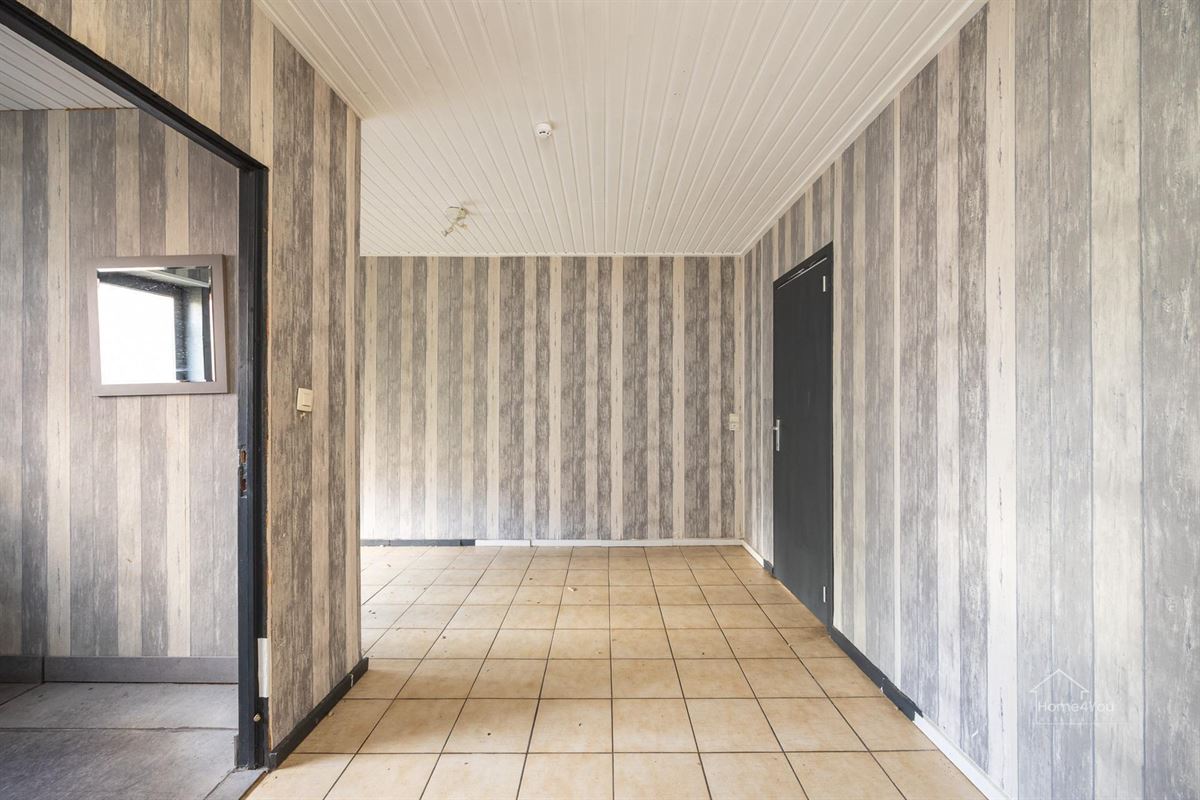 Te renoveren woning met 2 woonentiteiten + tuin