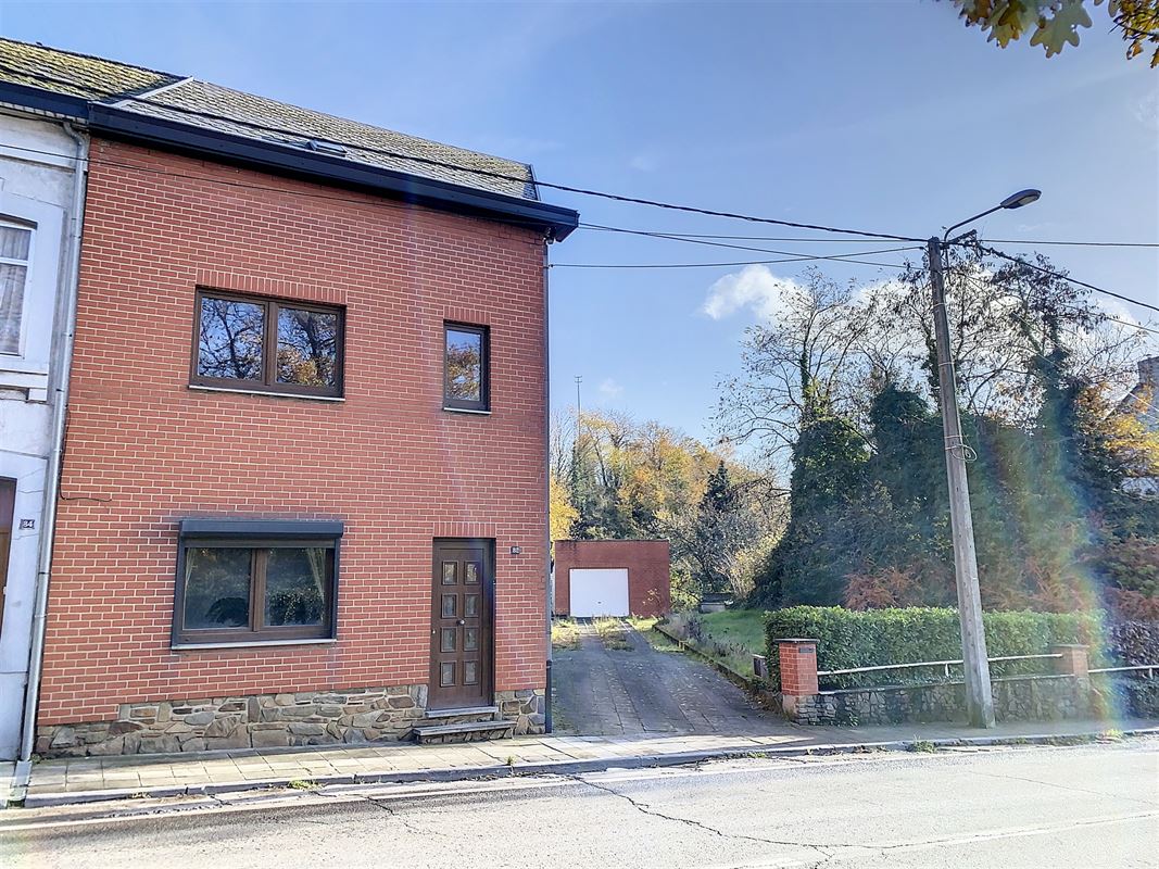 Maison 3 façades avec passage latéral, garage et grand jardin !