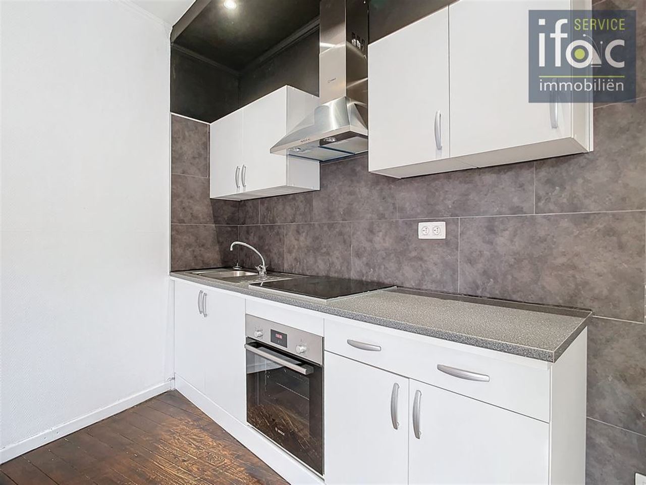 Opbrengstgebouw met handelsruimte en appartment