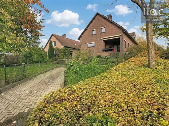 Huis met 4 slpks, 2 badk., tuin en garage