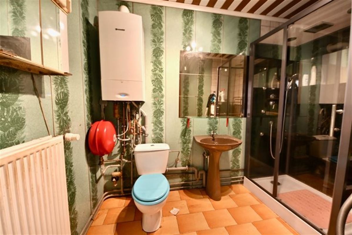 Te renoveren woning met 2 slaapkamers en tuin.