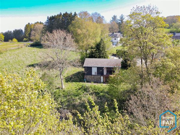 Beau chalet à rénover avec garage au grand calme sur 10a93.