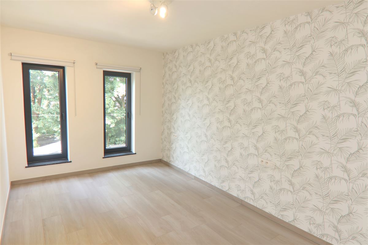 RUSTIG GELEGEN WONING MET 4 SLKS NABIJ HET STADSCENRUM