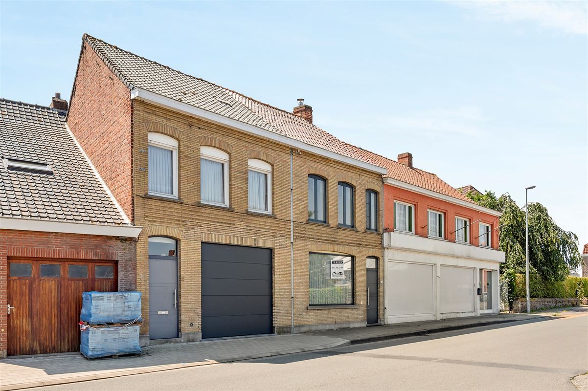 Rijwoning met grote garage/opslag en tuin