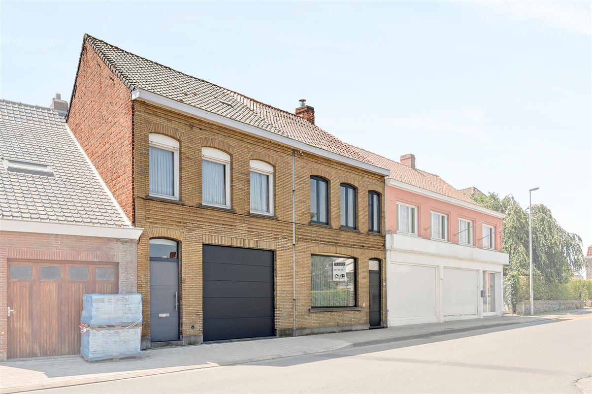 Rijwoning met grote garage/opslag en tuin