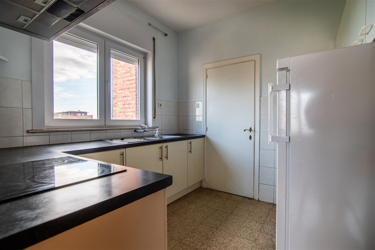 Op te frissen woning met 7 slaapkamers en ruime tuin aan het centrum van Tongeren.
