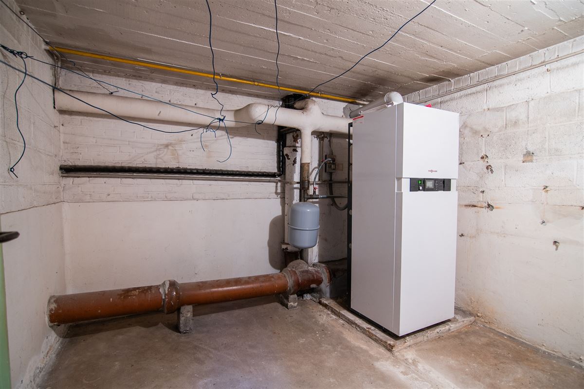 Op te frissen woning met 7 slaapkamers en ruime tuin aan het centrum van Tongeren.