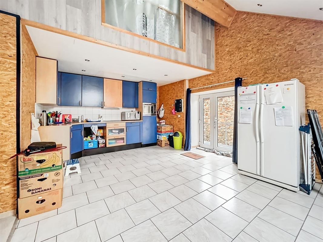 Dorpshuis met tuin en twee onafhankelijke woningen te Champlon