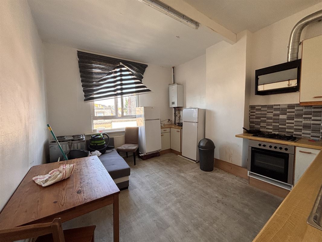 Opbrengsteigendom handelszaak + 3 appartementen