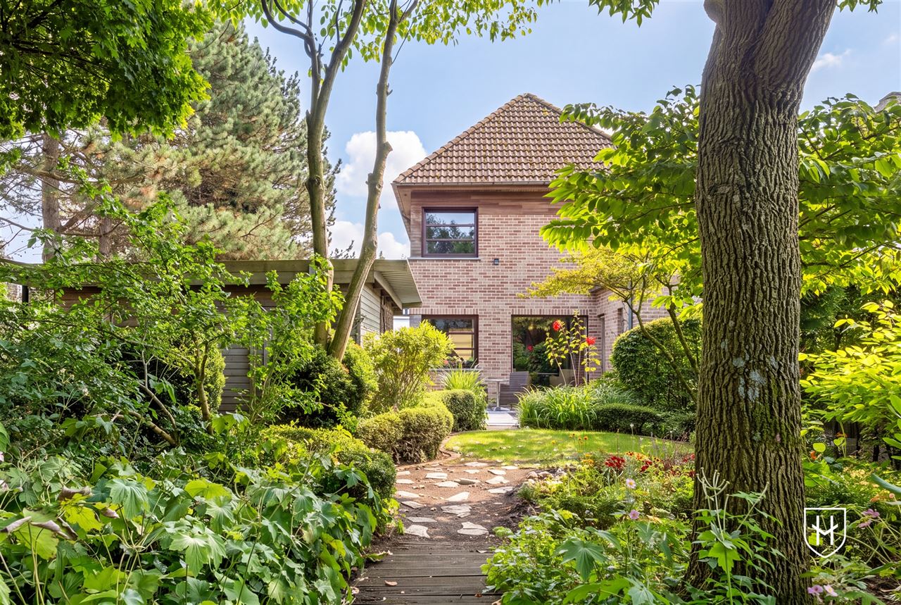Attractive house with 2 bedrooms and beautifully landscaped garden with ornamental pond and terrace, centrally located in Peer
