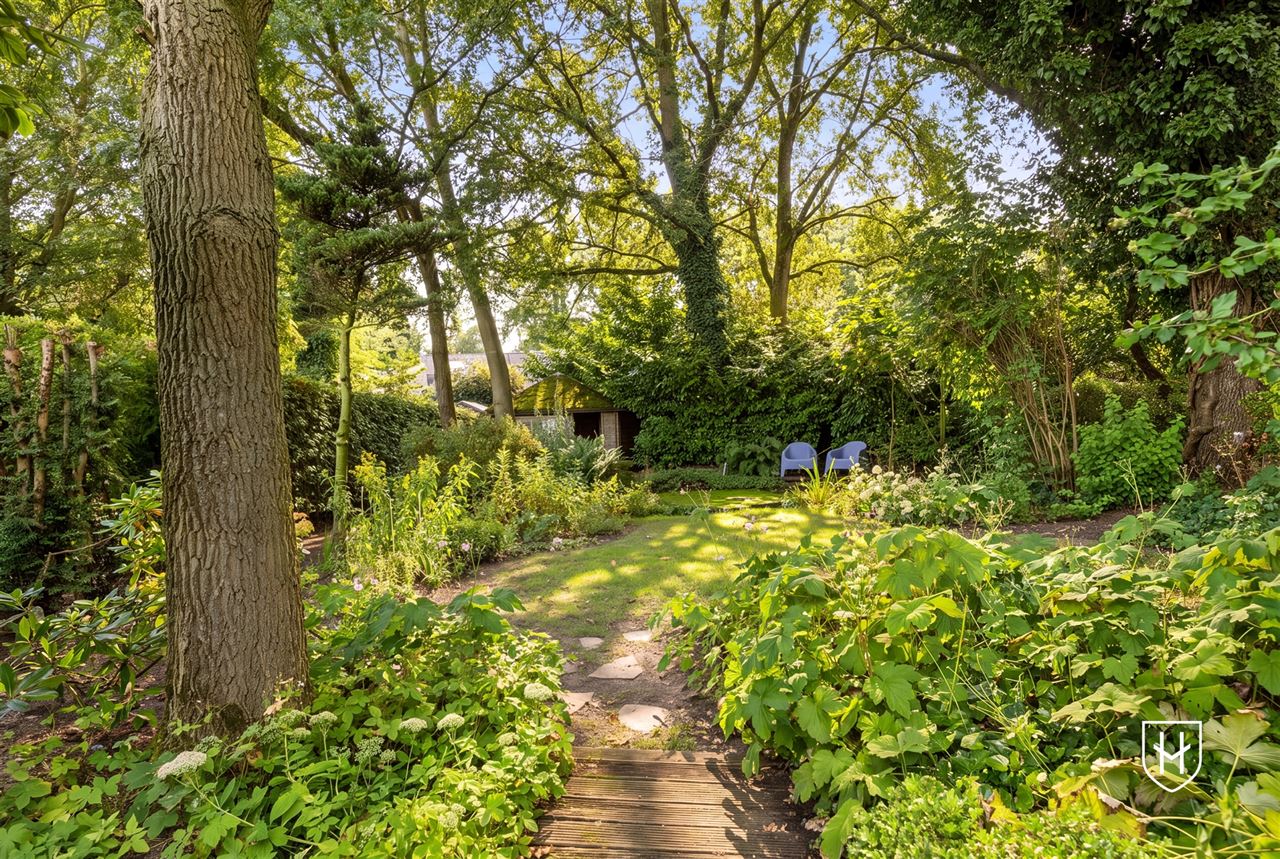 Attractive house with 2 bedrooms and beautifully landscaped garden with ornamental pond and terrace, centrally located in Peer