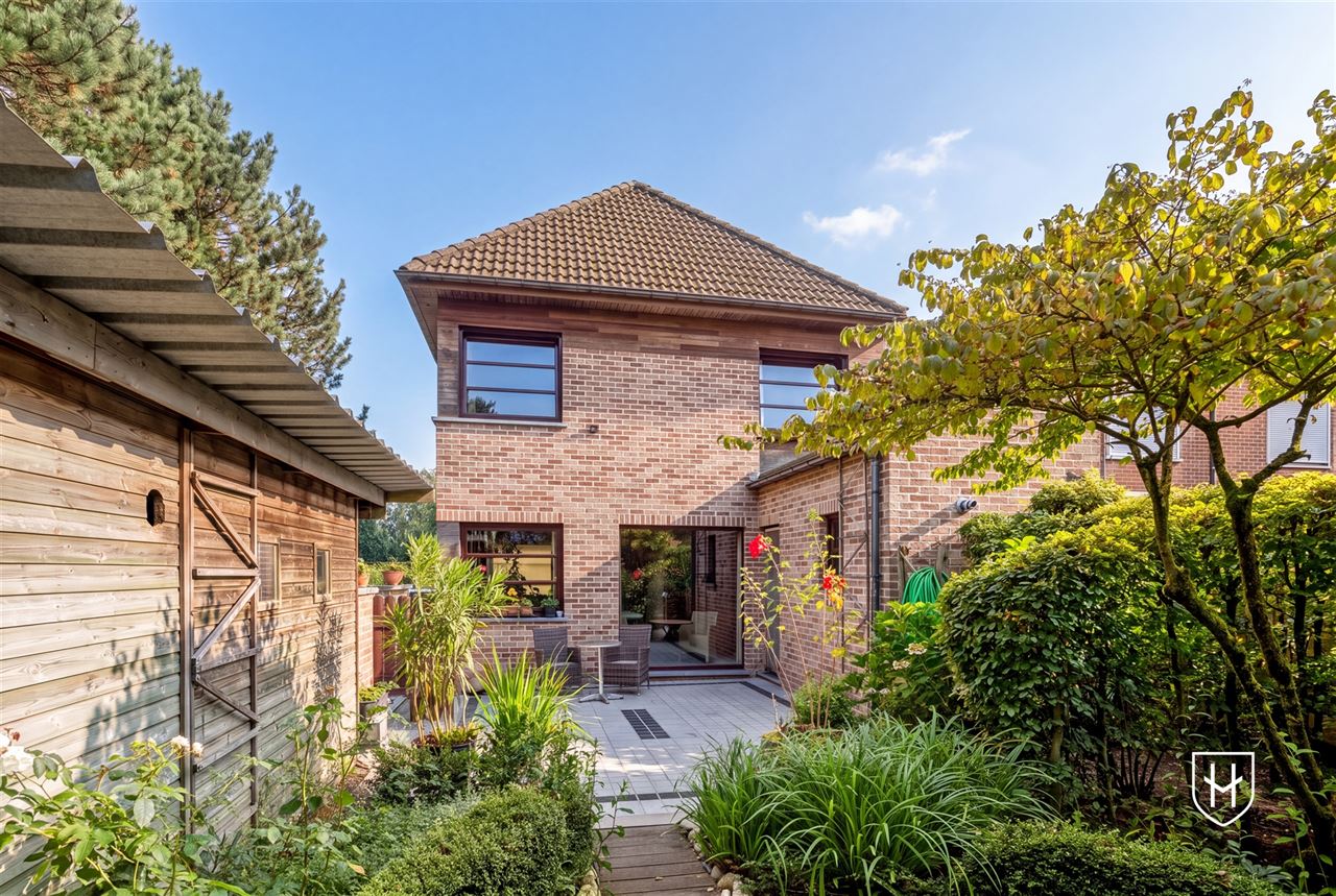 Attractive house with 2 bedrooms and beautifully landscaped garden with ornamental pond and terrace, centrally located in Peer