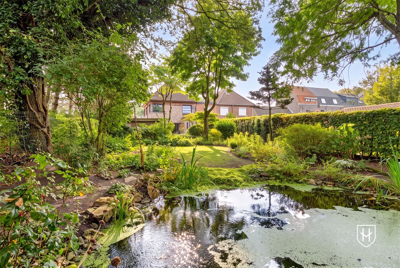 Attractive house with 2 bedrooms and beautifully landscaped garden with ornamental pond and terrace, centrally located in Peer