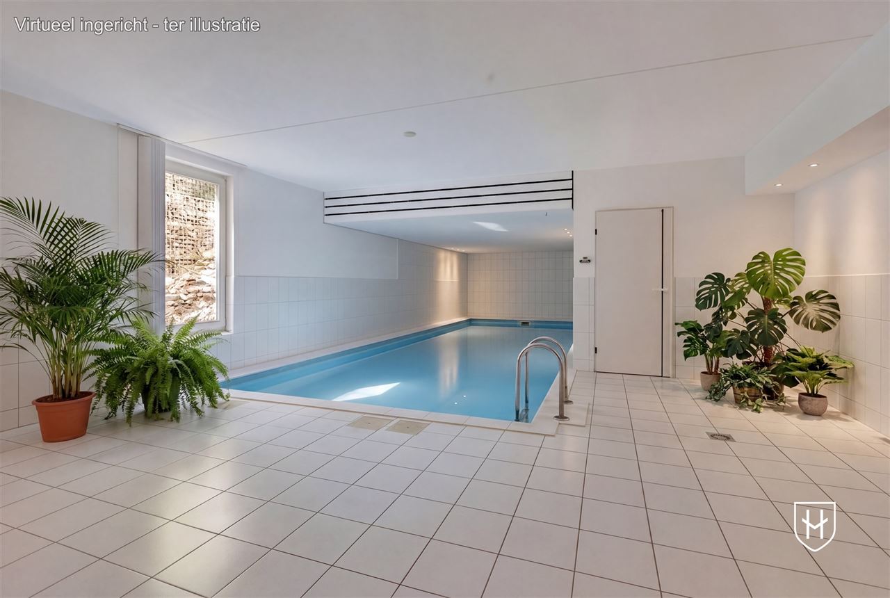 Architecturale villa met riante garage voor 10 wagens en binnenzwembad, op een schitterend perceel van 28a 89ca, prominent gelegen in vermaarde villawijk te Maasmechelen