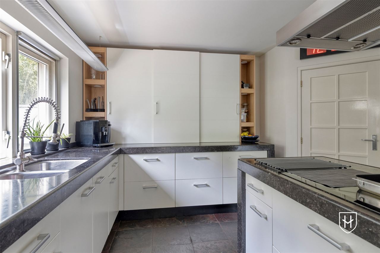 Architectural home with impressive living space with optimal garden contact and a special park garden with swimming pond with an exceptional nature experience
