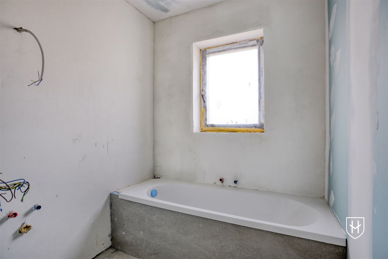 Spacieuse maison casco de construction récente avec 4 chambres et 2 salles de bain, sur un emplacement de choix à Lanaken-Neerharen