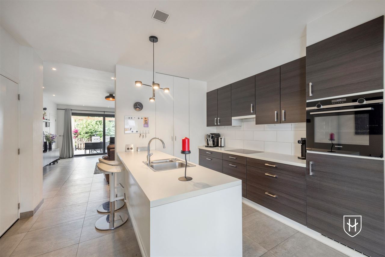 A modern, move-in-ready family home with a garage, carport, and sunny garden in the popular Lanaken-Rekem neighborhood