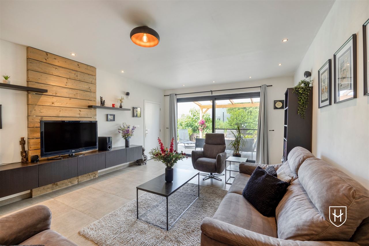 A modern, move-in-ready family home with a garage, carport, and sunny garden in the popular Lanaken-Rekem neighborhood
