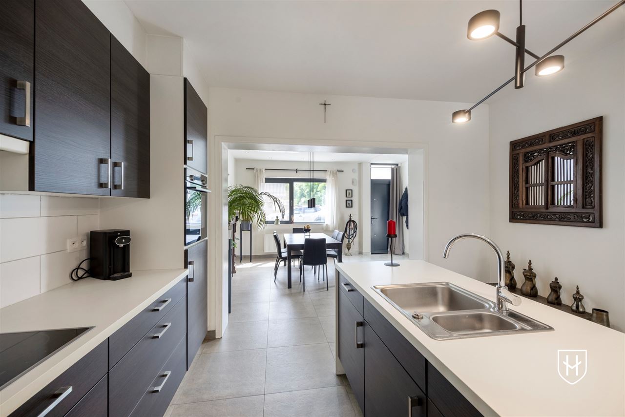 A modern, move-in-ready family home with a garage, carport, and sunny garden in the popular Lanaken-Rekem neighborhood