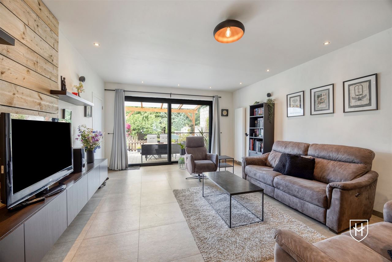 A modern, move-in-ready family home with a garage, carport, and sunny garden in the popular Lanaken-Rekem neighborhood