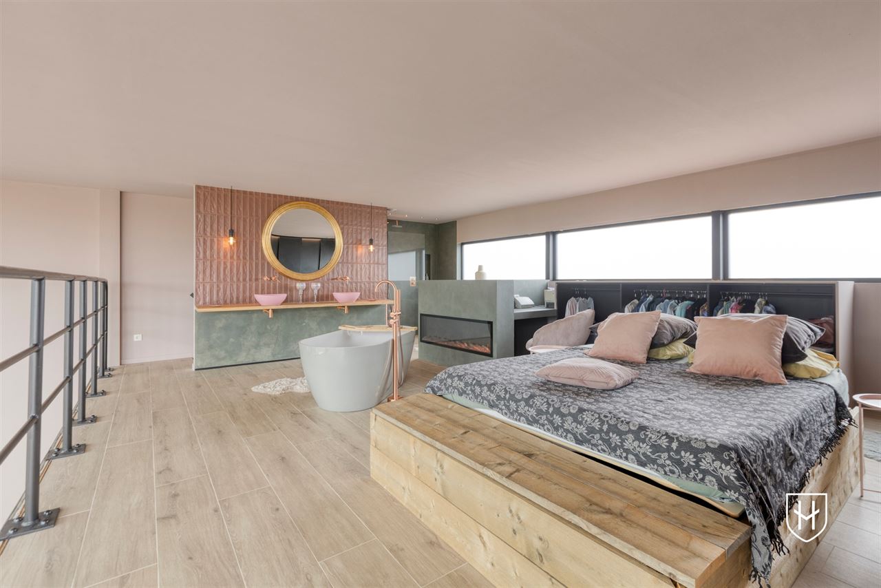 Architecturale loftwoning met hotel-chique interieur en vrij uitzicht op een uitstekende locatie aan de groene rand van Dilsen-Stokkem