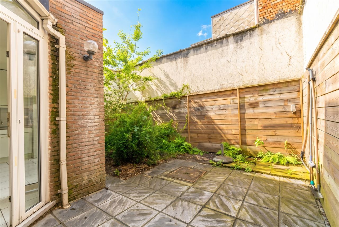 Gezinswoning met stadstuin & garage nabij Rivierenhof
