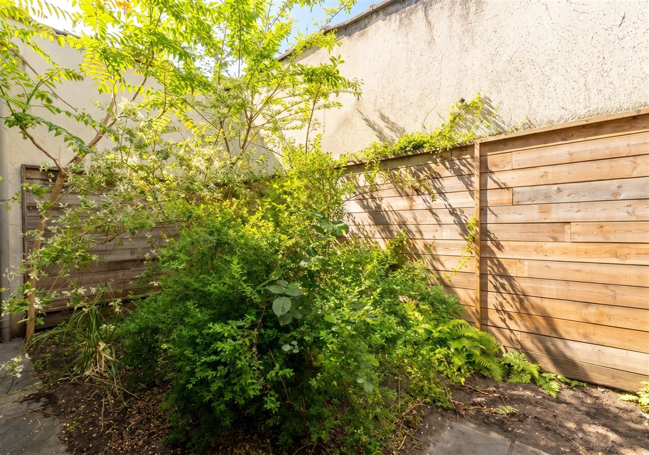 Gezinswoning met stadstuin & garage nabij Rivierenhof