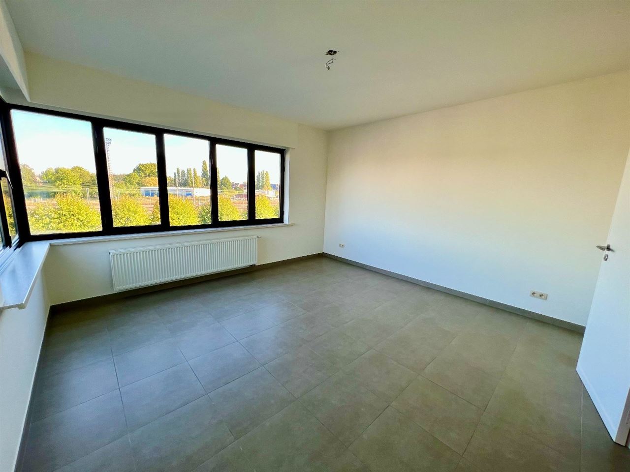 Ruim duplex-appartement met 1 slpk en bew. opp. van 70 m² op centrale ligging te Lier!
