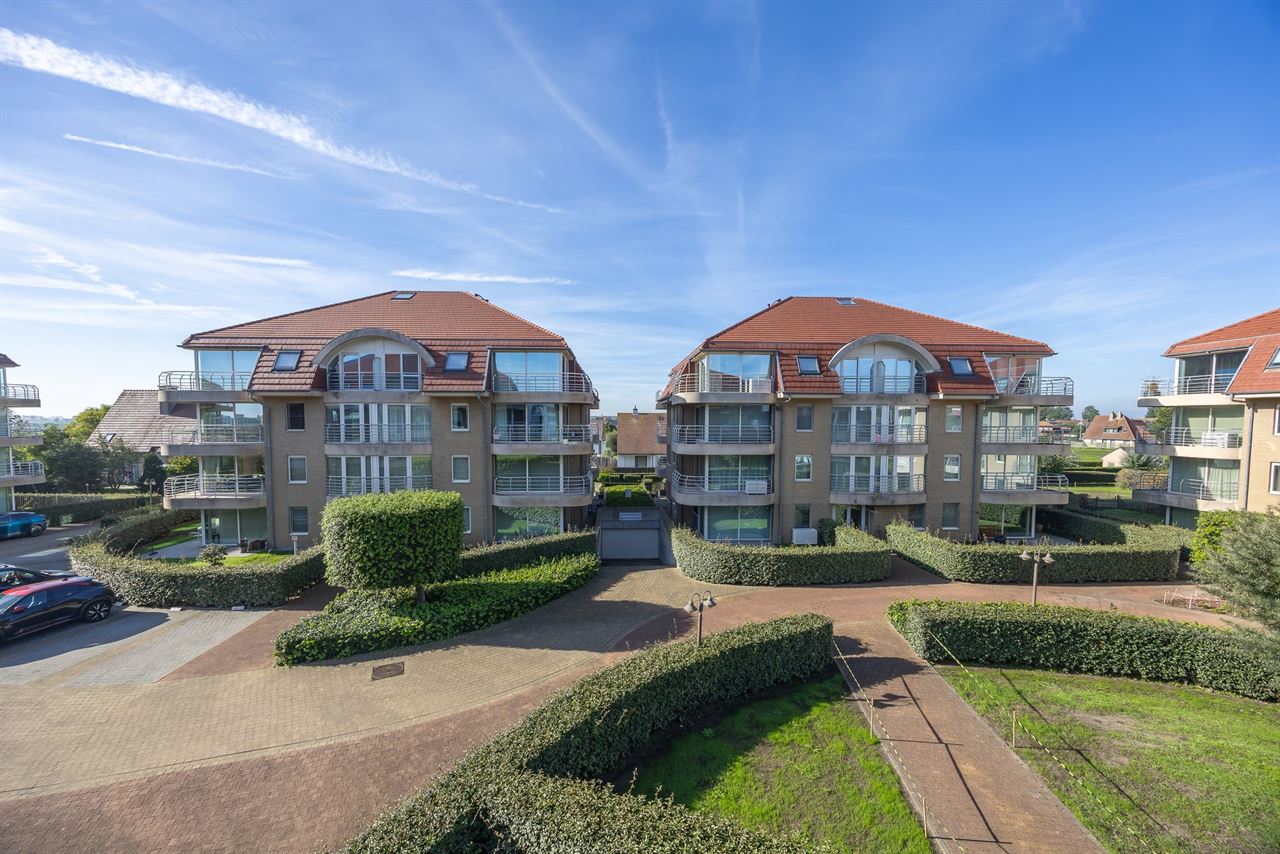 Zonnig 2 slpk hoekappartement met zuidgericht terras, garagebox, kelder en staanplaats