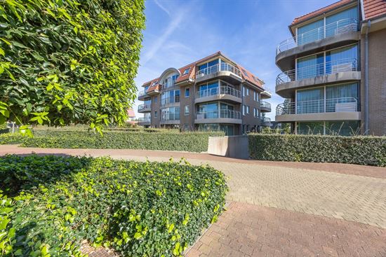 Zonnig 2 slpk hoekappartement met zuidgericht terras, garagebox, kelder en staanplaats