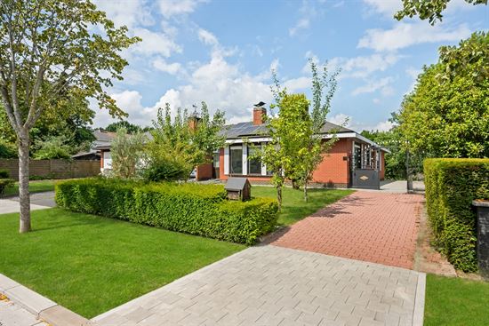 red-brick-bungalow-with-front-yard