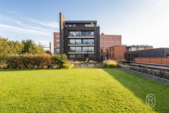 modern-apartment-building-with-green-field
